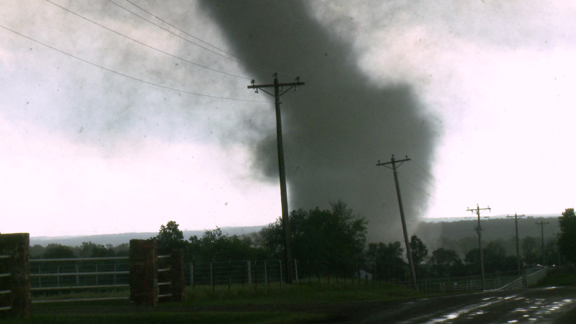 Tornado - zoom in, passes behind power lines