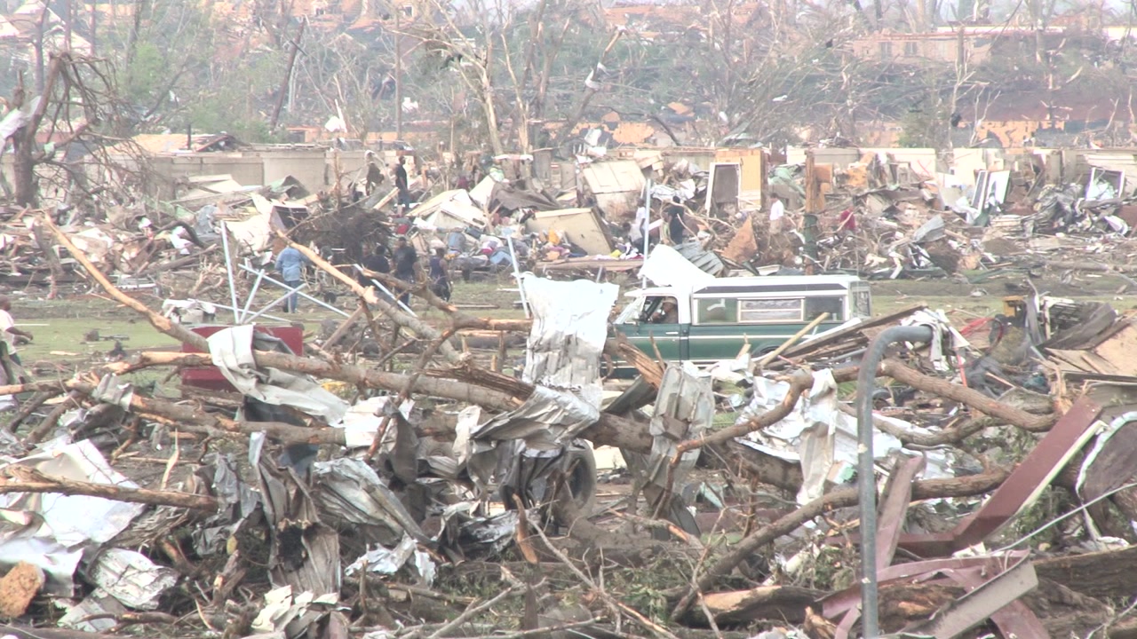 Tornado damage and aftermath - Pan of totally destroyed town
