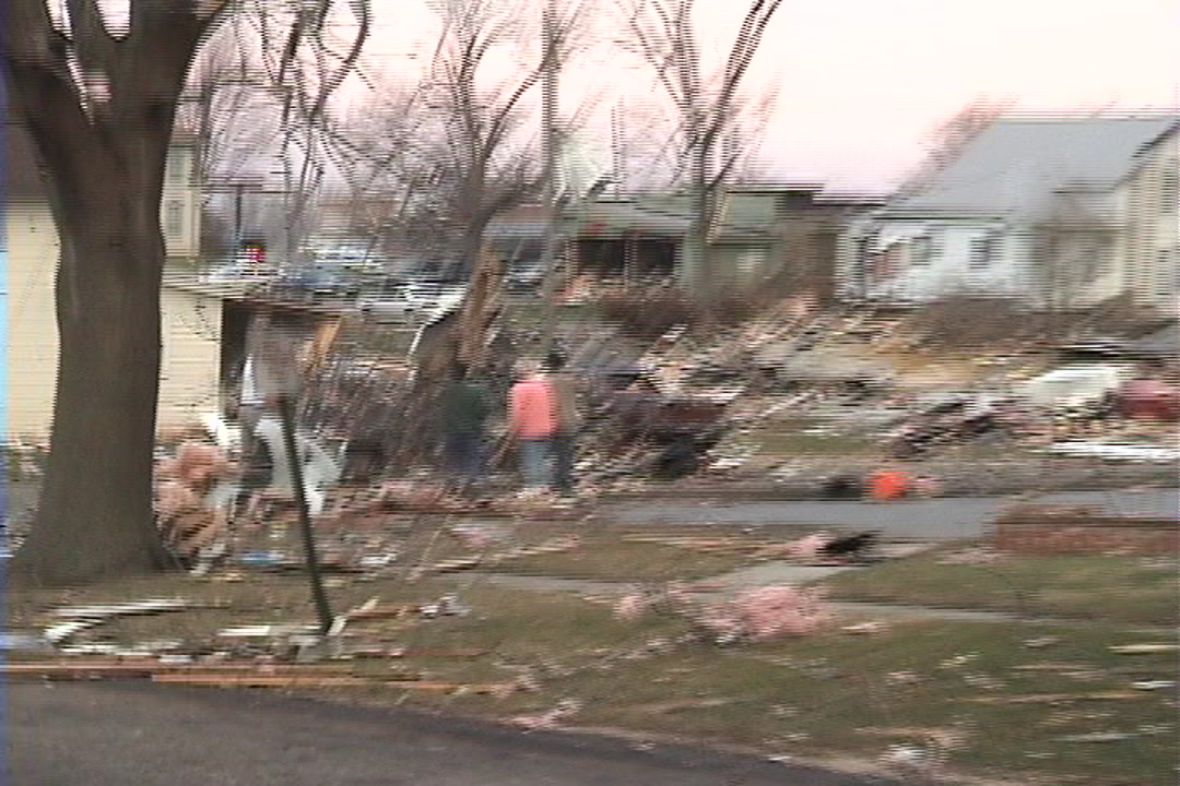 Tornado damage and aftermath - Widespread debris, woman crying, Woodward, Iowa