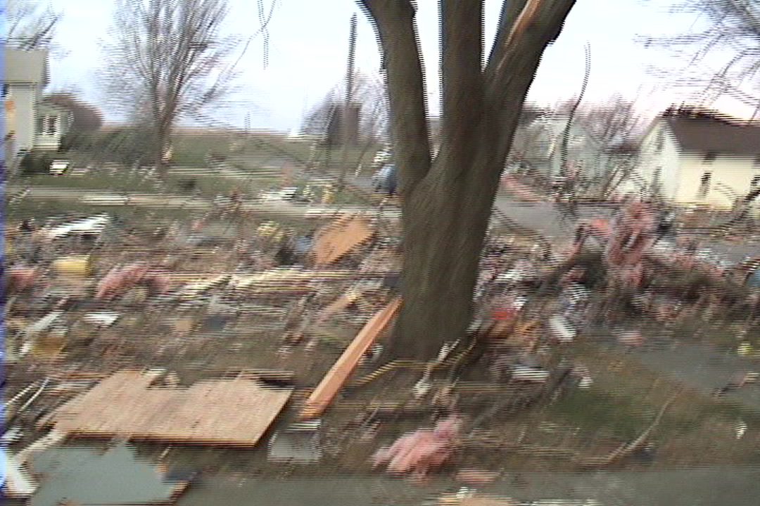 Tornado damage and aftermath - Woman in window, Woodward Iowa