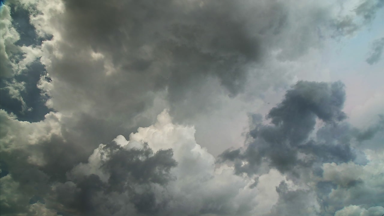 Beautiful sky, bright storm clouds converge - Super 35mm film to HD 1080