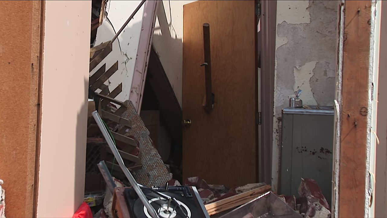 Zoom out from doorway, tornado debris - EF5 tornado aftermath damage, HD 1080