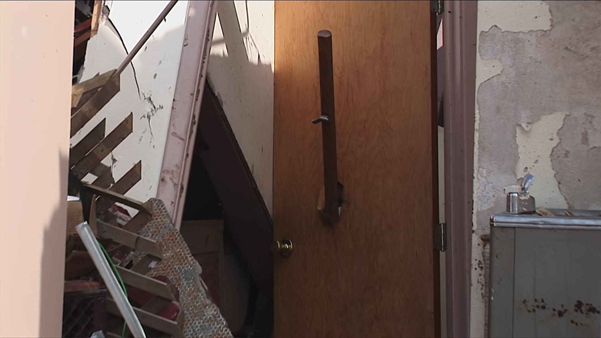 Zoom out from doorway, tornado debris - EF5 tornado aftermath damage, HD 1080