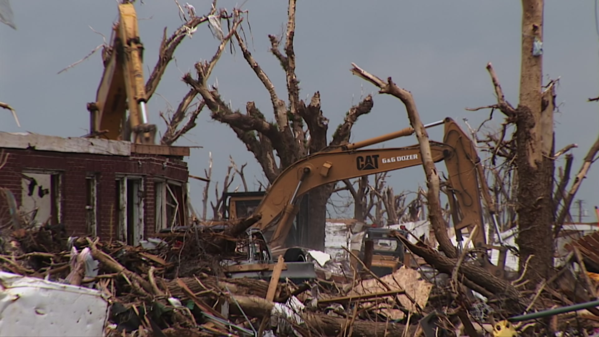 Crane works to remove remnants of damaged home - EF5 tornado aftermath damage, HD 1080