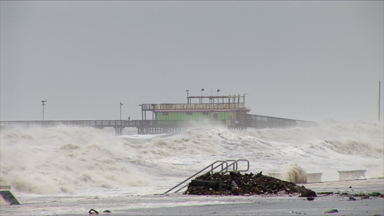 Big waves crash on seawall as truck drives by - extremely destructive Hurricane Ike, Galveston, 2008, HD 1080
