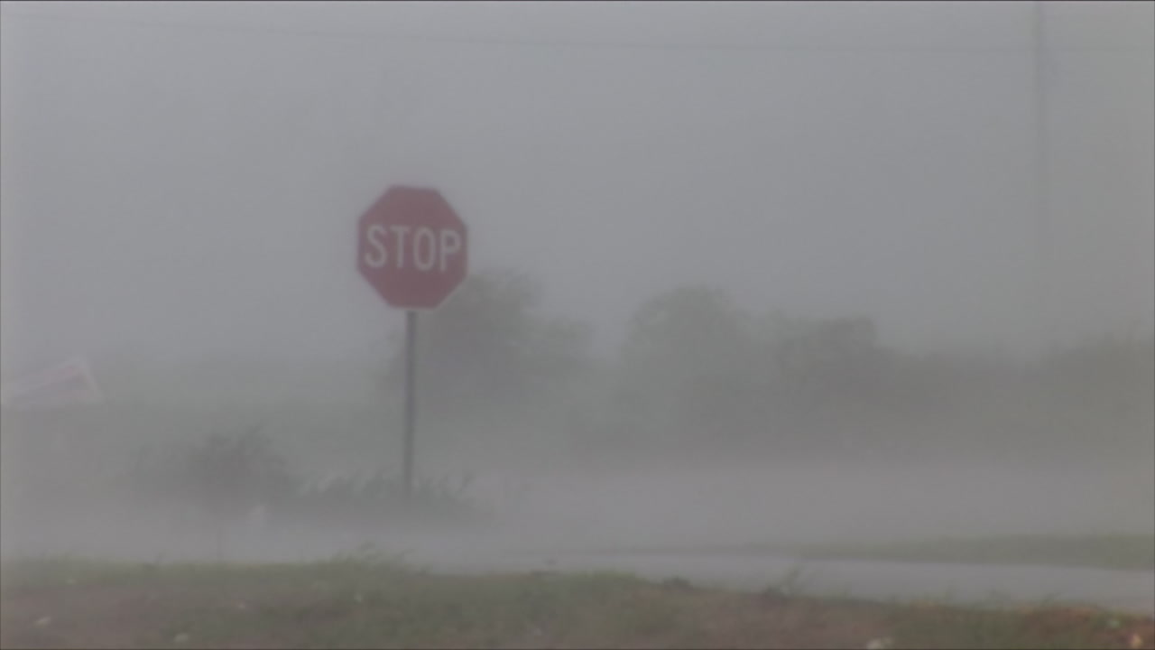Stop sign wobbles in strong hurricane winds, HD