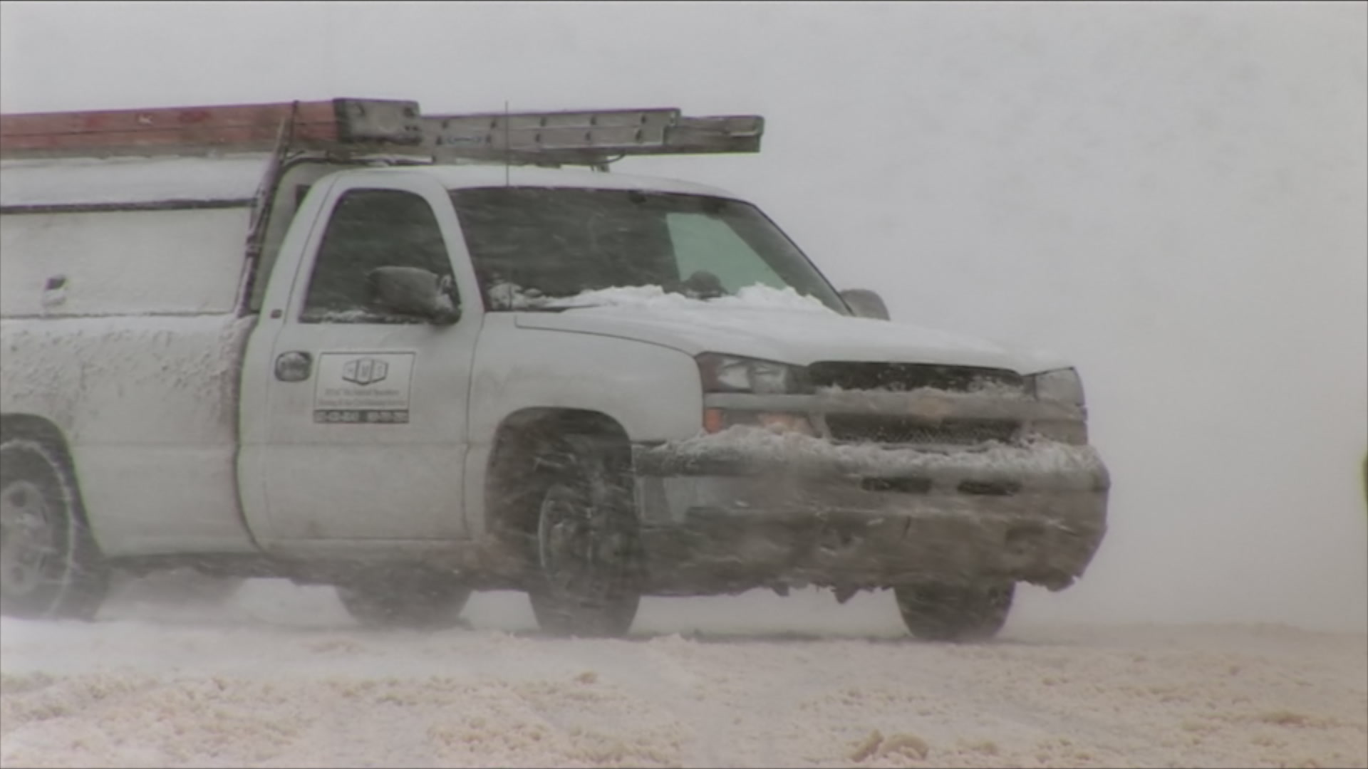 Cars drive through intense blowing snow - winter storm, HD 1080