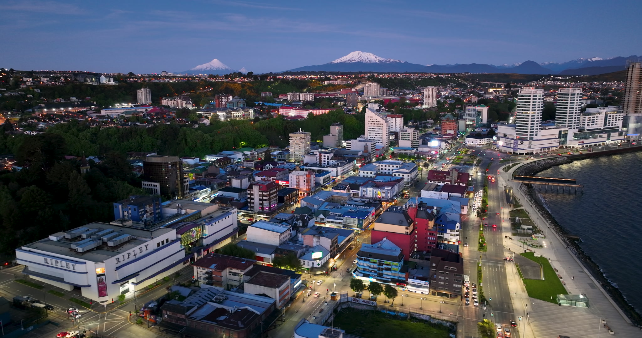 Aerial Tracking Right City and Volcano View