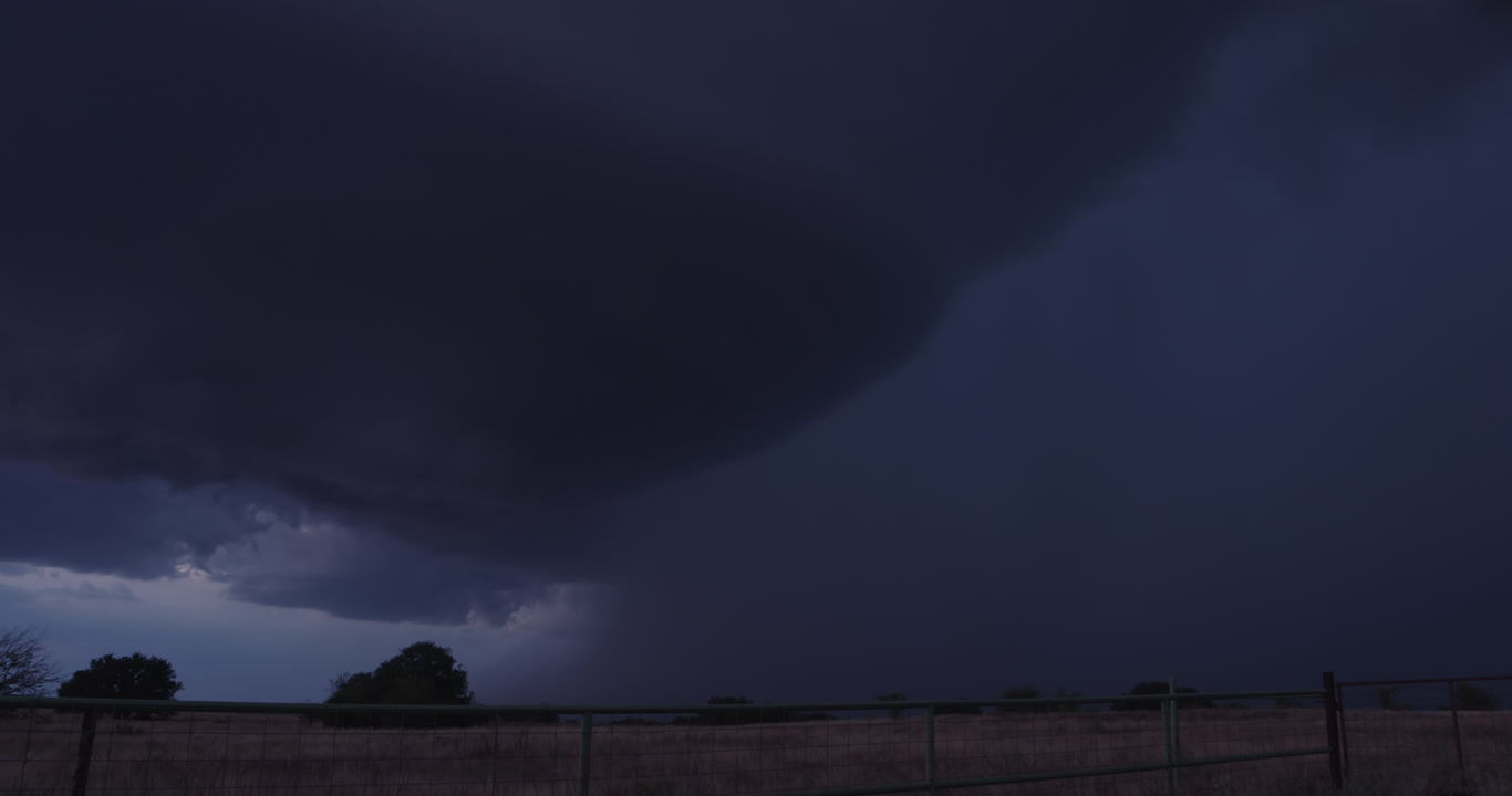 Two large, beautiful, forked cloud to ground (CG) lightning strikes, storm at dusk