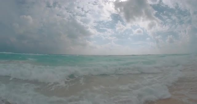 Low Angle Pan From Beach To Ocean Water On Lens Cancun