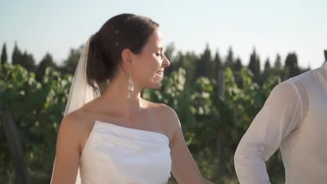 Just Married Taking A Walk Through Vineyard