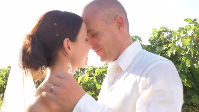 Close Up On Young Groom Kissing His New Wife
