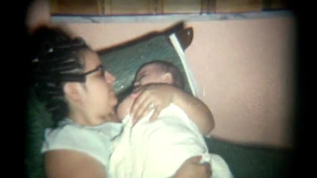 Vintage Film Mother Rocks Baby