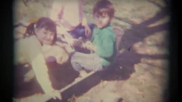 Vintage Film Kids Play in Sandbox