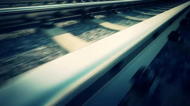 Loopable ride over railroad track. Close up of rail.