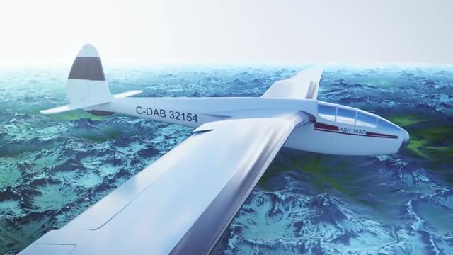 Sailplane over snow capped mountains.