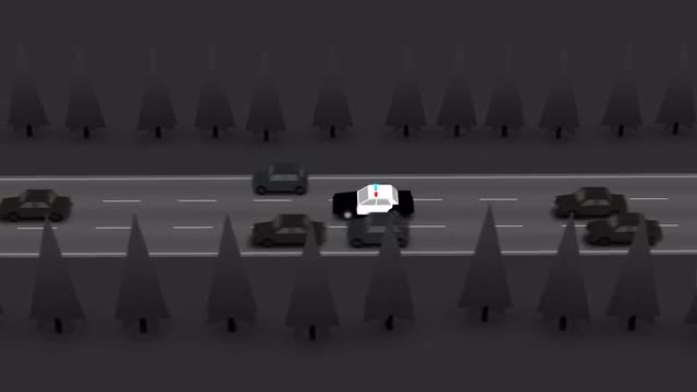 Police Car With Flashing Lights On Road