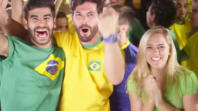 Brazilian Fans Watch a Soccer Game at a Sports Bar