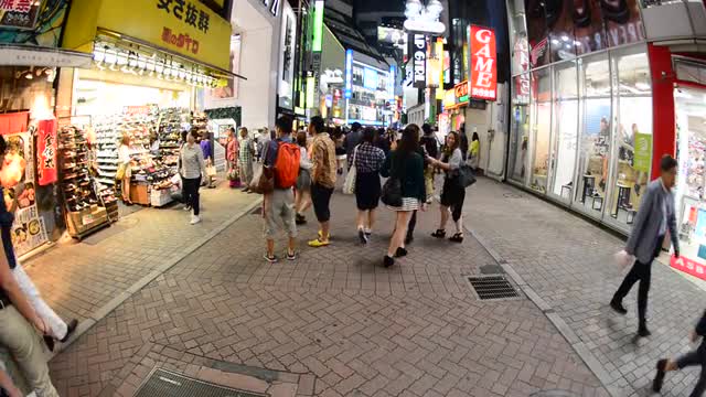 Pan Down - Busy Shinjuku Entertainment / Shopping District at Night - Tokyo Japan