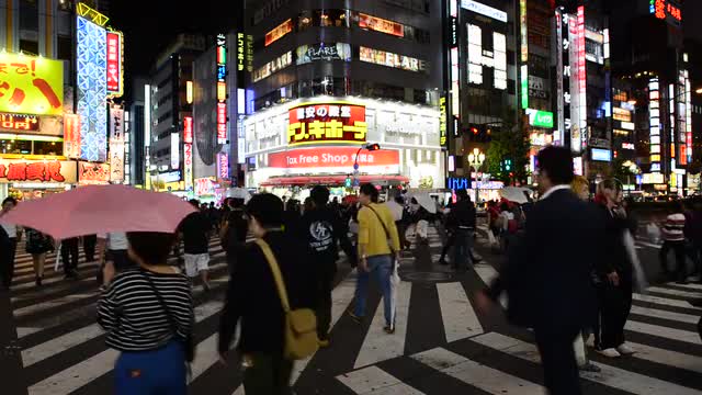 Busy Shinjuku Entertainment / Shopping District at Night - Tokyo Japan