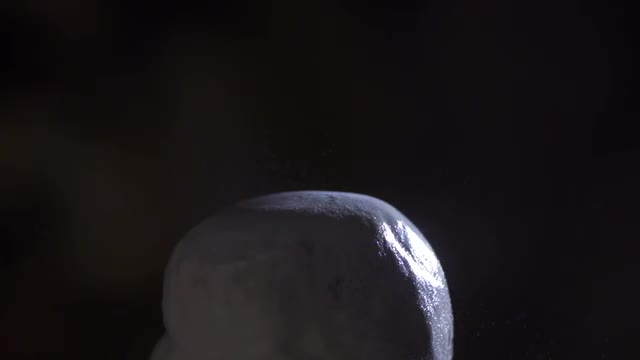 Drop Of Water Shutters In Molecules On White Lime Stone
