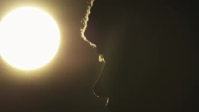 Man standing in front of light