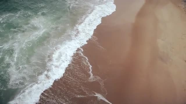Waves Crashing on Beach - Slowmotion Aerial
