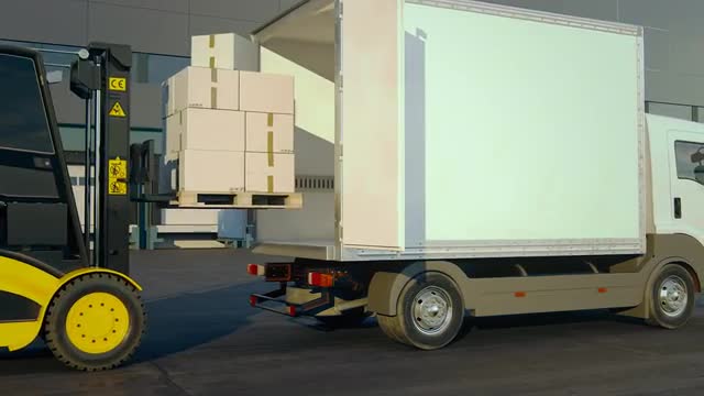 Forklift Unloading Stack Of Boxes In Truck