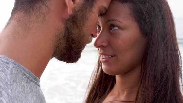 Brazilian couple embrace and look into each other's eyes
