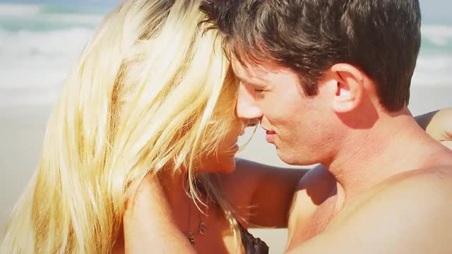 Couple embrace on a beach