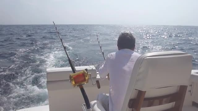 Man Placing Rod For Big Game Fishing
