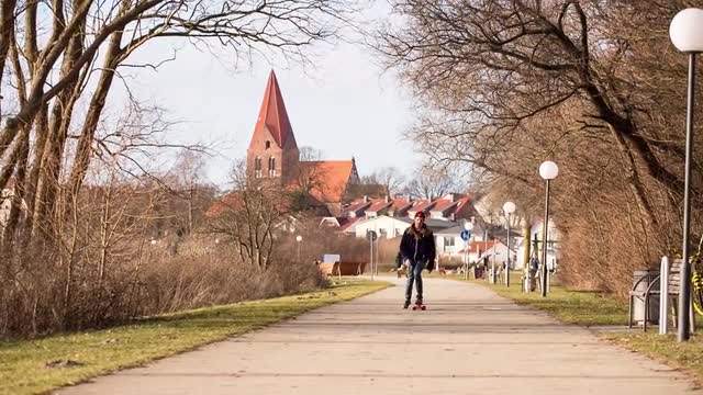 Longboarder Towards The Camera Citybackground