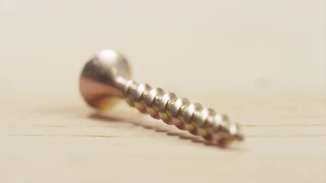 Screw lying on wood