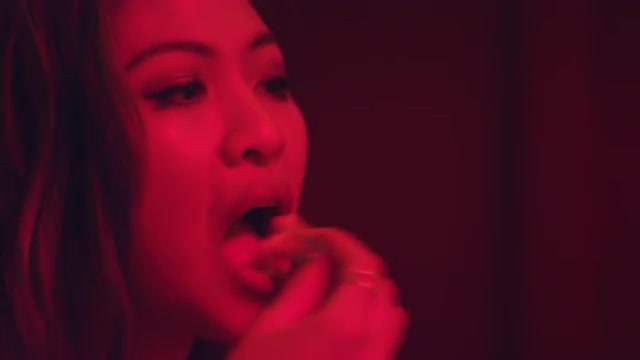 Closeup of a couple eating french fries and talking at a bar