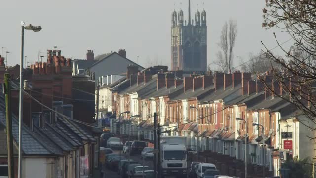 Terraced victorian housing and traffic in Small Heath, Birmingham, UK.