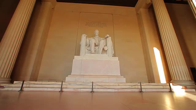 A static shot of the Abraham Lincoln statue at the Lincoln Memorial.