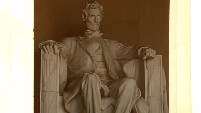 Static shot of the Abrahan Lincoln statue inside the Lincoln Memorial in Washington DC