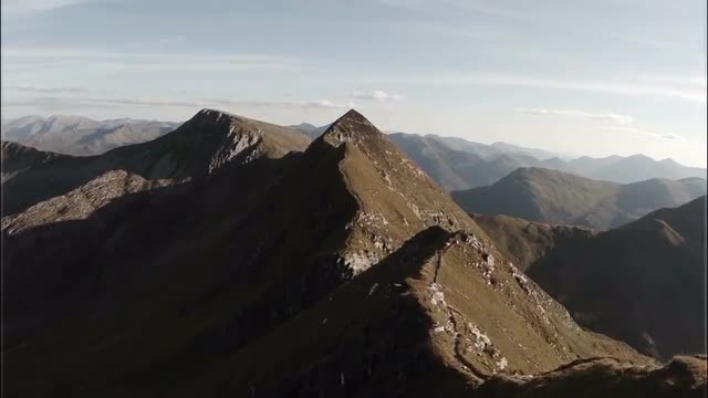 Spectacular aerial shot on Sgurr a'Mhaim mountain revealing devils ridge in the Scottish highlan