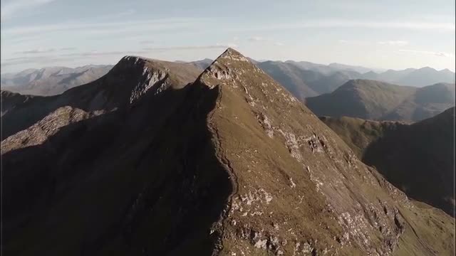 Spectacular aerial shot on Sgurr a'Mhaim mountain revealing devils ridge in the Scottish highlan
