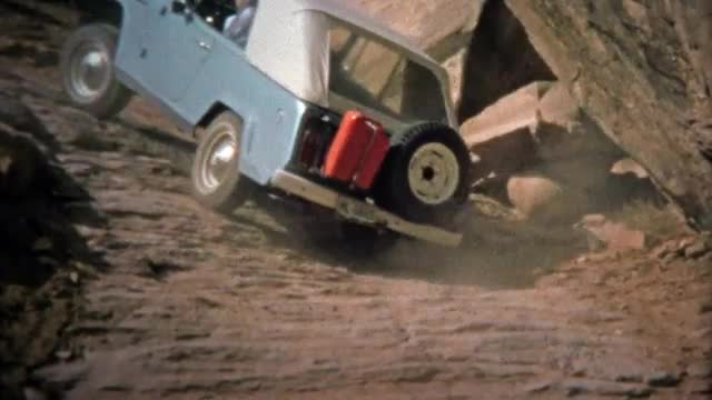 CANYONLANDS, UTAH -1971: Jeep climbing hills at Elephant Hill off-road track. 