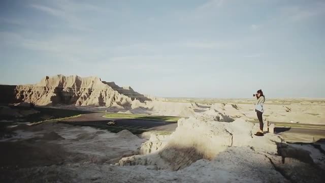 Girl Taking Photos In Badlands
