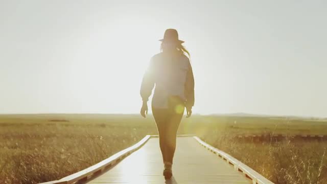 Girl Walking On Raised Platform Field
