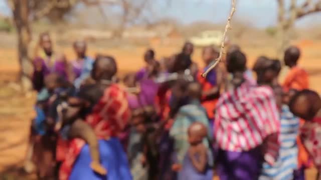 Children from Maasai Mara tribe in Tanzania singing and dancing