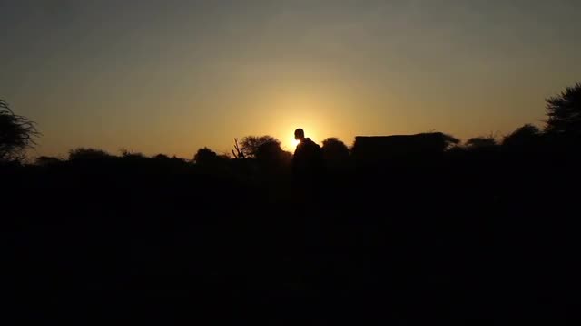 African sunrise in Tanzania with Maasai tribe