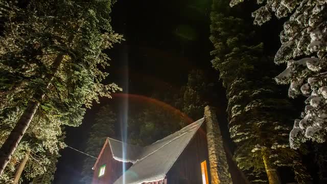 Snowy Cabin Under the Stars - Time Lapse
