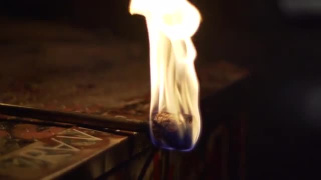 Torch Burning On Decorated Chest