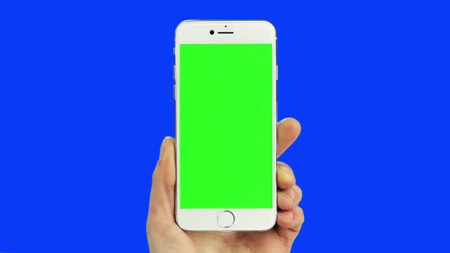 White smart phone chroma key blue and green with real hand