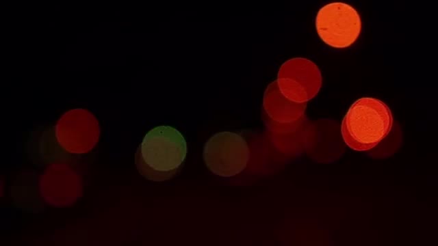 Out of focus city and cars lights in slow motion