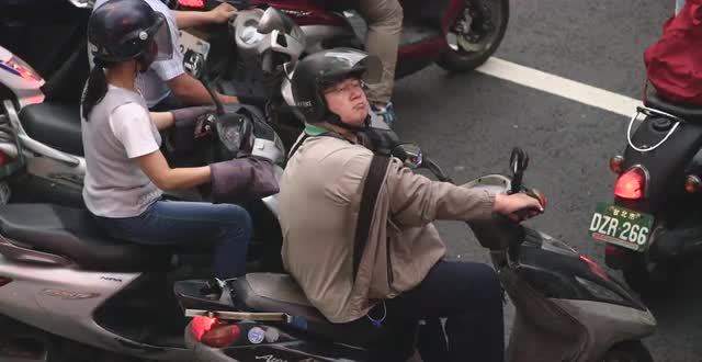 Moped Rider in Downtown Taipei