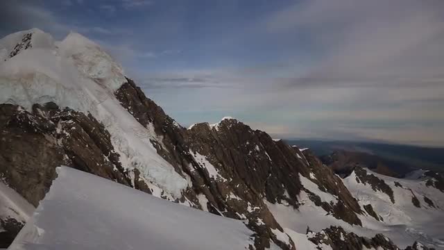 Footage of snowy mountain peaks near Fox Glacier in New Zealand 2